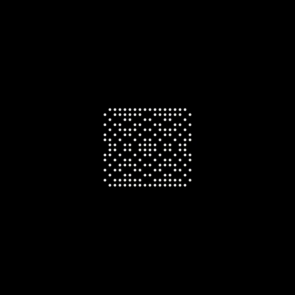 A small block of dots with two overlapping ring systems.